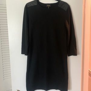 Black fabric dress with leather shoulder to back detail.